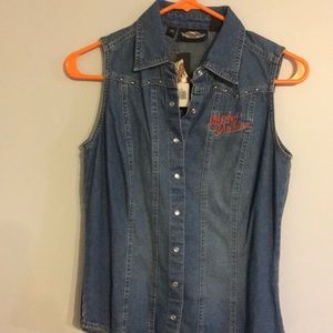 Ladies snap front, denim, short sleeve shirt.